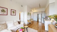 Located at 1625 NW 20th in Miami, FL, this thoughtfully designed 2-bedroom, 1-bathroom unit offers a bright and efficient single-floor layout. The open-concept living, dining, and kitchen area is anchored by warm wood-look flooring, soaring ceilings, and an abundance of natural light. A full-width sliding glass door leads to a private balcony, where expansive city views stretch across the Miami skyline — a standout feature of the living space.

The kitchen is well-appointed with light-toned flat-front cabinetry extending to the ceiling, stainless steel appliances including a French door refrigerator, electric range, built-in microwave, and dishwasher, all complemented by clean white countertops.

The primary bedroom is a comfortable retreat featuring a large picture window that frames striking elevated city views, with light hardwood flooring continuing throughout. The second bedroom offers a cozy, well-proportioned space ideal for guests or a home office.

The bathroom is finished with light cabinetry, a white countertop vanity, a large mirror, and hardwood-style flooring, maintaining the unit's clean, modern aesthetic. Two closets provide practical storage. The overall ambiance is light, airy, and contemporary — well-suited to Miami's vibrant lifestyle.
