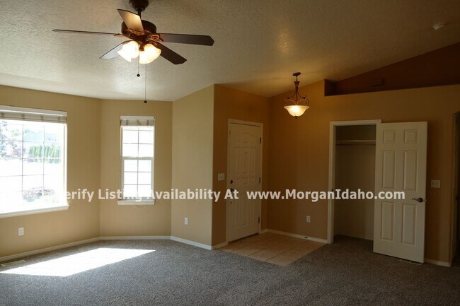 Building Photo - 3-car garage, storage shed, vaulted ceilin...