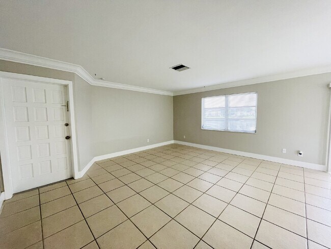 Building Photo - Updated 2-bedroom waterfront duplex with walk-in closets, enclosed Florida room, and canal views ...