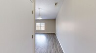 This contemporary 880 square foot apartment offers a thoughtfully designed living space with two bedrooms and two bathrooms. The open-concept layout creates a seamless flow between the living areas, enhancing the sense of spaciousness. The kitchen is a highlight, featuring modern cabinetry, stainless steel appliances, and ample counter space, making it ideal for cooking and entertaining.

The primary bedroom, measuring 130 square feet, provides a comfortable retreat with plush carpeting and ample natural light from large windows. Both bathrooms are well-appointed with modern fixtures and finishes, including a combination tub-shower in one and a standalone shower in the other.

Throughout the apartment, neutral tones and light wood-look flooring create a bright and airy ambiance. The living room and bedrooms feature large windows that flood the spaces with natural light. For added convenience, the unit includes an in-unit laundry area with a full-size washer and dryer.

The apartment's layout maximizes functionality, with a hallway connecting the various rooms and providing easy access to all areas of the home. Overall, this apartment offers a modern and comfortable living environment with updated features and a practical design.