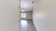 This contemporary 880 square foot apartment offers a thoughtfully designed living space with two bedrooms and two bathrooms. The open-concept layout creates a seamless flow between the living areas, enhancing the sense of spaciousness. The kitchen is a highlight, featuring modern cabinetry, stainless steel appliances, and ample counter space, making it ideal for cooking and entertaining.

The primary bedroom, measuring 130 square feet, provides a comfortable retreat with plush carpeting and ample natural light from large windows. Both bathrooms are well-appointed with modern fixtures and finishes, including a combination tub-shower in one and a standalone shower in the other.

Throughout the apartment, neutral tones and light wood-look flooring create a bright and airy ambiance. The living room and bedrooms feature large windows that flood the spaces with natural light. For added convenience, the unit includes an in-unit laundry area with a full-size washer and dryer.

The apartment's layout maximizes functionality, with a hallway connecting the various rooms and providing easy access to all areas of the home. Overall, this apartment offers a modern and comfortable living environment with updated features and a practical design.