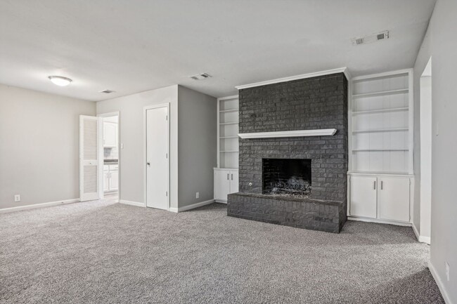 forest-ridge-apartments-denton-tx-two-bedroom-living-room-fireplace - Forest Ridge Apartments