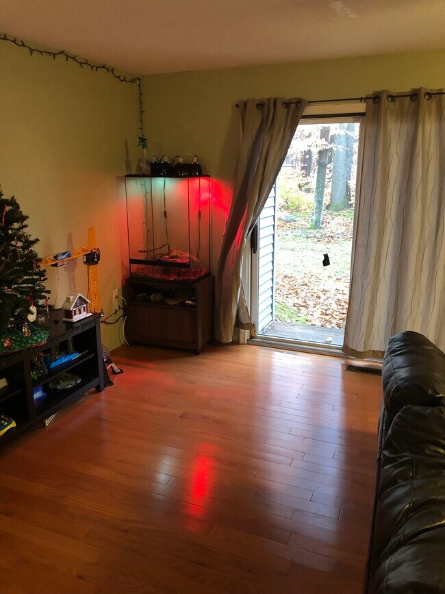 Hardwood floors though the main level and stairs. Dual sliding doors to private wooded patio. - 56 Uplands Way