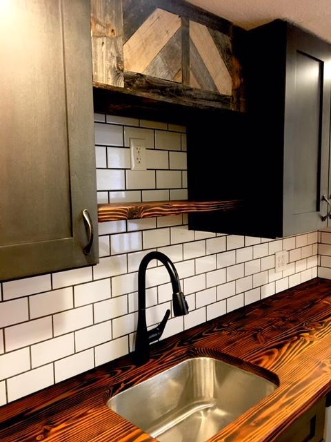 REMODELED KITCHEN- Custom flamed wood counter, space-saving microwave shelf, new sink, pull out faucet, and reclaimed wood accents - 2261 Newark st