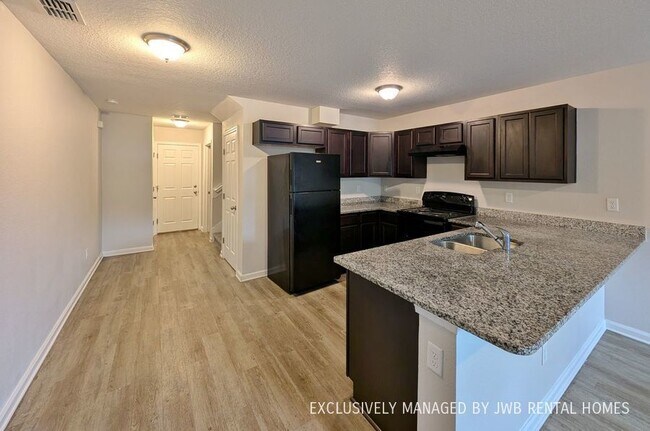 Building Photo - 8468 McGirts Village Ln