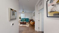 Located at 9005 Alderman Dr in Austin, TX, this single-story, three-bedroom, two-bathroom home offers a thoughtfully designed layout that maximizes every square foot. The open-concept kitchen and living area serves as the heart of the home, with the kitchen showcasing white shaker cabinetry, granite countertops, a classic subway tile backsplash, and a full suite of stainless steel appliances. A sliding glass door off the living area opens to a private outdoor patio, filling the space with natural light and providing seamless indoor-outdoor access. The living room features warm hardwood-style flooring, a ceiling fan, and large windows with blinds. The spacious primary bedroom includes a ceiling fan, generous closet with built-in shelving and hanging rods, and direct access to the hallway. The two bathrooms are well-appointed — one features a granite-topped vanity, skylight, and a tiled shower-tub combo, while the second offers a sleek walk-in shower with white subway tile and a frameless glass slider. The two additional bedrooms are bright and comfortable, each with ceiling fans and windows. Neutral tones and modern finishes throughout create a clean, cohesive aesthetic ideal for a variety of lifestyles.