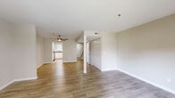 Located in Nashville, TN, this two-story residence offers 2 bedrooms and 3 bathrooms across two well-proportioned floors. The main level features an open living area with light wood-style flooring, neutral warm-toned walls, and a ceiling fan, creating a bright and airy atmosphere. The kitchen is a standout feature, outfitted with white shaker-style cabinetry, granite countertops, a classic subway tile backsplash, and a full suite of stainless steel appliances including a range, microwave, dishwasher, and refrigerator. A window above the sink allows natural light to fill the space. Three bathrooms serve the home, including one featuring marble-style tile surrounding the tub and shower, a granite-topped vanity with white cabinetry, and a warm wood-framed mirror. A tucked-away half bath with a sloped ceiling adds a charming architectural detail. The upper floor hosts both bedrooms, each carpeted for comfort, with ample closet space and access to the hallway and staircase. The spacious primary bedroom features a large window with views of surrounding greenery. Two dedicated closets provide generous storage throughout the home.
