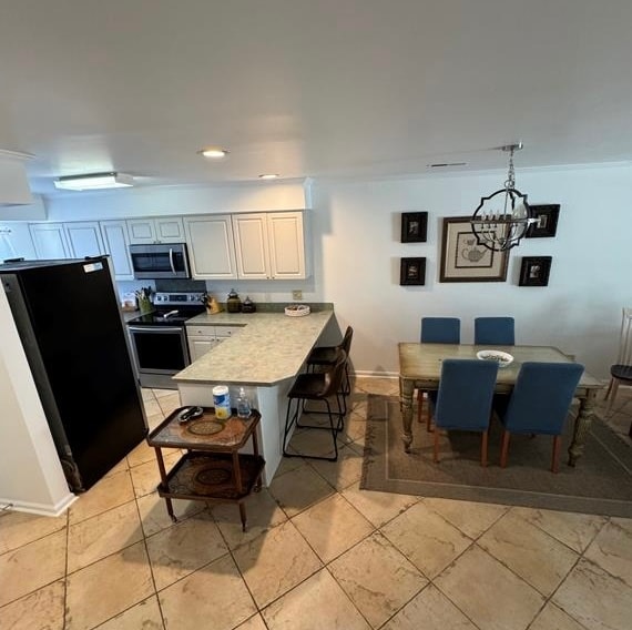 Kitchen counter seating and dining room. - 10027 Washington Cir
