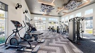 Located at 1542 Bartlett Lane in Sacramento, CA, this contemporary fitness center offers a well-appointed, single-floor workout facility designed to support a wide range of exercise needs. The space is defined by its soaring double-height ceilings adorned with striking geometric acoustic panels and warm wood-toned beam accents, creating a visually dynamic and acoustically comfortable environment. Large floor-to-ceiling windows and transom windows line the perimeter walls, flooding the interior with abundant natural light and offering views of the surrounding outdoor amenities, including a pool area and landscaped grounds. The patterned herringbone carpet tile flooring adds a modern aesthetic throughout. The cardio zone is well-equipped with treadmills, ellipticals, a stair climber, rowing machines, and a dedicated spin cycling area featuring individual screens. The strength training section includes a multi-functional cable machine, a comprehensive dumbbell rack, and a variety of selectorized resistance machines. Wall-mounted televisions are positioned throughout for entertainment during workouts. Wall-mounted fans provide additional ventilation and comfort. The open floor plan maximizes usability across the generous footprint, offering ample space between equipment for safe and comfortable movement throughout every workout.