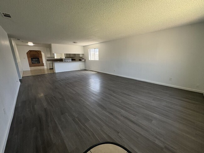 Building Photo - Large Living Area, rear yard has RV Access!