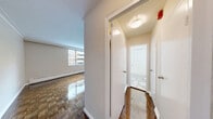 Located at 1516 Bathurst Street in Toronto's vibrant Cedarvale neighbourhood, this studio unit offers a well-organized and efficiently designed single-floor layout. The living area is highlighted by classic parquet hardwood flooring that gleams underfoot, crown moulding along the ceiling, and a large sliding window that fills the space with natural light while framing views of the surrounding neighbourhood and greenery. A baseboard heating system runs along the exterior wall, ensuring year-round comfort. The kitchen is thoughtfully appointed with white cabinetry extending to the ceiling for ample storage, a grey subway tile backsplash, dark granite countertops, stainless steel appliances including a refrigerator and electric range, and light tile flooring that distinguishes it from the living area. A peninsula counter with a dark granite top and a built-in support leg provides an ideal spot for casual dining or meal prep. The bathroom is clean and bright, featuring full white subway tile walls surrounding a soaking bathtub with shower, a pedestal sink, and a mirrored medicine cabinet. A hallway connects the principal spaces, lending a practical flow to the overall layout. This unit is ideal for those seeking a functional and characterful home in a well-connected Toronto location.