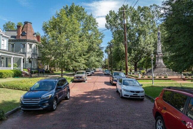 Cars line a historic street in Columbus, GA.