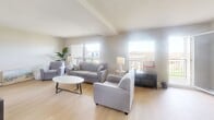 This well-appointed 3-bedroom, 2-bathroom residence in Waterloo, Ontario offers a thoughtfully designed layout across a single floor. The bright and airy living room features light hardwood flooring, large windows that flood the space with natural light, and direct access to one of two balconies, providing open views of the surrounding cityscape. The adjacent dining area continues the light, welcoming aesthetic with a ceiling fan overhead and a generous corner window that frames urban views, making it an ideal space for everyday meals or entertaining.

The generously sized primary bedroom is a serene retreat, complete with a ceiling fan, large windows overlooking the city, and seamless access to a private balcony. The two additional bedrooms are versatile and well-proportioned, with light hardwood floors and ample natural light. Both bathrooms are finished with classic white cabinetry, tile flooring, and mirrored storage, offering clean and functional design.

Connecting the rooms are well-proportioned hallways with crown moulding details and tile flooring. Throughout the residence, neutral tones and clean lines create a calm, cohesive ambiance. The two balconies extend the living space outdoors, offering elevated views of Waterloo's vibrant surroundings.