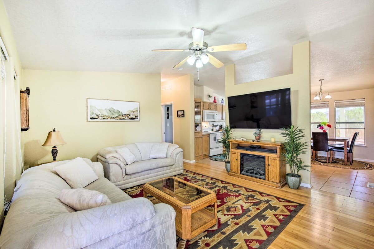 New couch and love seat in living room, now brown leather. - 10157 S Tornado Ave