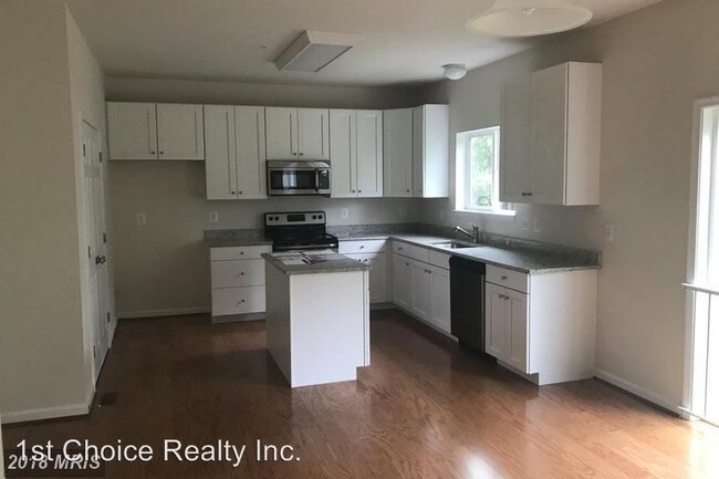Building Photo - 4 br, 2.5 bath House - 1404 Woodmead Ct