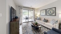 Located in Sandy Springs, GA, this 2-bedroom, 2-bathroom single-floor residence offers a thoughtfully designed layout with modern finishes throughout. The living room serves as the heart of the home, featuring wood-style flooring, a textured ceiling, and a sliding glass door that floods the space with natural light and opens directly onto a private outdoor patio. The kitchen is well-equipped with rich dark cabinetry, granite countertops, stainless steel appliances, and a classic subway tile backsplash. It flows seamlessly into a dedicated dining room, which features wood-style flooring, large windows with natural light, a stylish pendant light fixture, and arched decorative mirrors. A secondary dining area with additional natural light provides flexible living options. The spacious primary bedroom features plush carpeting, a ceiling fan, vaulted ceiling detail, and direct access to a private bathroom. The second bedroom is equally comfortable, also with carpeting and a ceiling fan. Both bathrooms are finished with wood-style tile flooring — one offering a shower-tub combination and the other a dedicated shower. Two closets provide ample storage, and a hallway connects the rooms efficiently. The overall ambiance is bright, neutral, and move-in ready.