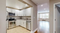 Located at 29 Linden St in Hackensack, NJ, this one-bedroom, one-bathroom residence offers a thoughtfully designed single-floor layout with a comfortable, functional flow throughout. Rich hardwood flooring runs through the living areas, bedroom, and hallway, lending warmth and continuity to the space.

The living room is generously proportioned, featuring recessed lighting, a large window with blinds that invites natural light, and views of the surrounding neighborhood. The kitchen is well-equipped with white shaker-style cabinetry, granite countertops, stainless steel appliances including a refrigerator, range, microwave, and dishwasher, and light tile flooring — offering both style and practicality.

The spacious primary bedroom features a ceiling fan with integrated lighting, a wall-mounted HVAC unit, and a bright window with outdoor views. The walk-in closet is outfitted with an extensive built-in shelving and storage system, providing exceptional organizational capacity. The bathroom includes a vanity with a wood cabinet base and white countertop, a tiled tub-shower combination, and tile flooring, completing the space with clean, neutral finishes throughout.
