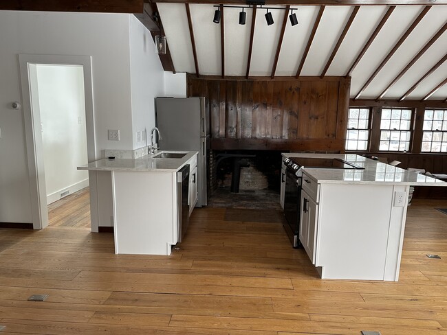 Private mudroom entry to the left ; Kitchen area with island counter seating - 5166 Shelburne Rd
