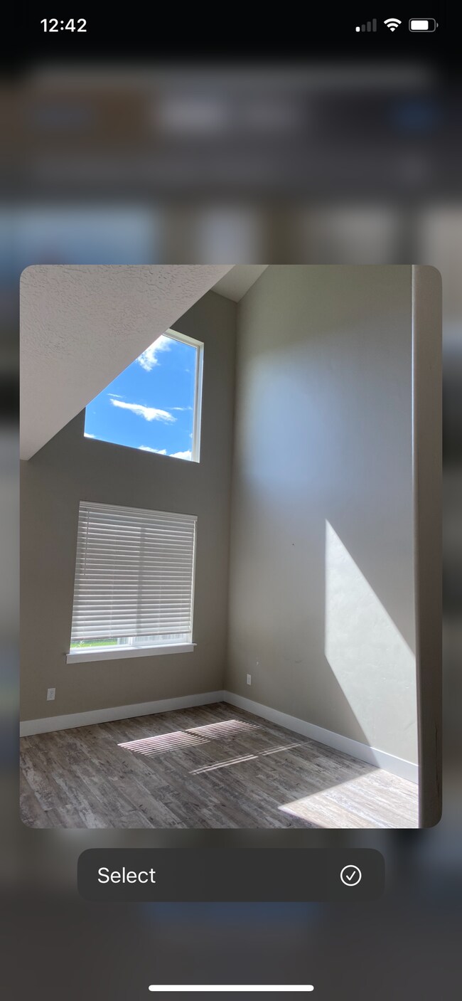 living room- it is now furnished with 2 couches. very tall ceiling and lots of light. - 1908 S 1080 W