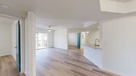 This well-appointed 3-bedroom, 3-bathroom single-story home in Pembroke Pines, Florida offers a bright and cohesive living environment throughout. Light wood-style flooring runs consistently across all rooms, creating a clean and unified aesthetic.

The open kitchen is a standout feature, showcasing white shaker cabinetry, granite countertops, a teal subway tile backsplash, stainless steel appliances, and a peninsula with an undermount sink — ideal for both cooking and entertaining. The combined kitchen and living area flows seamlessly and opens via sliding glass doors to a private balcony, allowing natural light to fill the space. Ceiling fans are installed in the living and bedroom areas to complement Florida's climate.

The primary bedroom offers generous proportions and connects to a well-designed bathroom featuring white cabinetry, granite countertops, a large mirror, and a glass-enclosed shower. Additional bedrooms are bright and comfortable, with windows framing leafy outdoor views. Two closets with wire shelving systems provide practical storage throughout.

Each bathroom maintains a consistent, clean design with granite vanities and modern fixtures. A dedicated laundry room with wire overhead shelving and washer/dryer hookups adds everyday convenience. The hallway connects all areas efficiently, rounding out a functional and attractive single-floor layout.