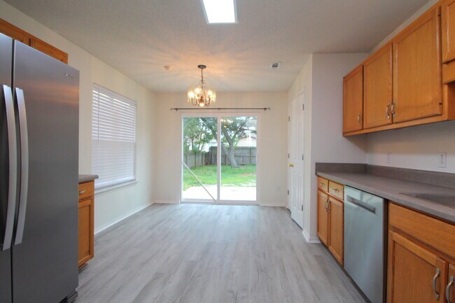Building Photo - Updated 3BR/2BA Home with 2-Car Garage, Brand New LVP Flooring, Fresh Paint, Open Living Spaces &...