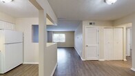 This 2-bedroom, 3-bathroom single-floor residence in Columbus, Ohio offers a practical and comfortable layout designed for everyday living. The combined living and dining area is bright and open, featuring wood-style hard flooring, neutral warm-toned walls, a textured ceiling, and a window that fills the space with natural light — creating a welcoming, airy atmosphere. A louvered door leads to additional storage nearby.

The kitchen is well-appointed with white cabinetry, laminate countertops, a full suite of white appliances including a dishwasher, electric range, and refrigerator, complemented by a window above the sink area for added brightness.

Both bedrooms are carpeted for comfort and feature neutral tones. The generously sized primary bedroom includes multiple closets — with both open and sliding-door configurations — providing ample storage. The second bedroom also benefits from natural light via a window with outdoor views.

Three bathrooms serve the home, with one featuring a glass-door shower enclosure and wood-style flooring. Additional spaces include a hallway, utility room, pantry, and four closets throughout. The layout, as seen in the 3D model, is efficiently organized for a smooth flow between rooms, making this a functional and well-rounded home.