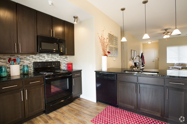 Unit Kitchen - SunSTONE at MarketPlace Apartments