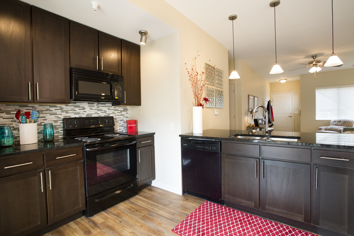 Unit Kitchen - SunSTONE at MarketPlace Apartments