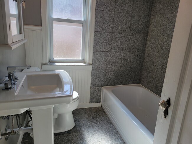 Granite tile floor and bath inlay - 7230 W Park Ave