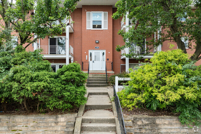 Wooded Entranceway - Hilltop Apartments