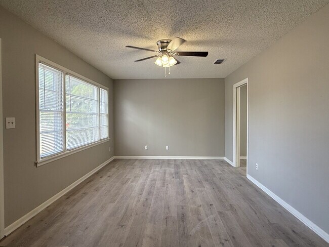 Building Photo - Fresh Paint, New Floors, and a Fresh Start!