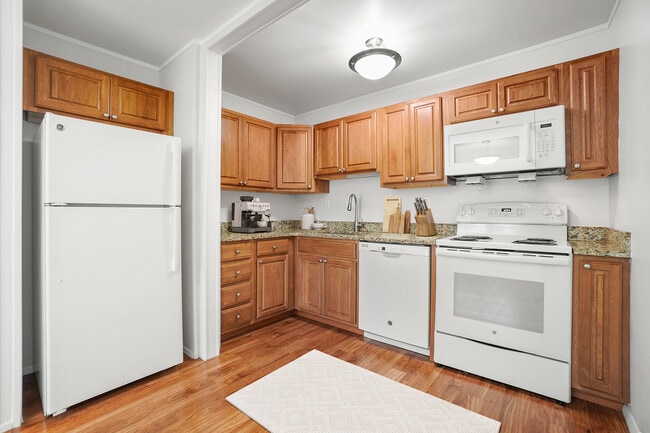 Kitchen - from dining room view with fridge, dishwasher, stove, microwave, sink, essentials, and decor ( VS )1 - Taunton Gardens