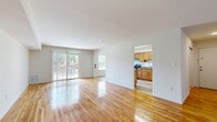 Located at 744 Cheryl Dr in Iselin, NJ, this well-appointed 2-bedroom, 2-bathroom residence offers a thoughtfully designed single-floor layout. Warm hardwood flooring flows consistently throughout the living areas, bedrooms, and hallway, lending a cohesive and inviting character to the home.

The open-concept living and dining area is generously sized and filled with natural light, courtesy of large sliding glass doors that lead directly to a private balcony with outdoor views. The adjacent kitchen features warm wood cabinetry, granite countertops, stainless steel appliances including a refrigerator and range, and light vinyl plank flooring — providing a functional and attractive space for cooking and entertaining.

The spacious primary bedroom offers ample room and includes closet access, while the second bedroom is comparably well-sized with its own closet. The residence features five closets in total, ensuring abundant storage throughout. Both bathrooms are finished with granite-topped vanities, wood cabinetry, tiled surrounds, and tasteful fixtures. A connecting hallway ties all rooms together efficiently. The clean white walls and bright, airy aesthetic throughout the home create a neutral and move-in-ready environment.