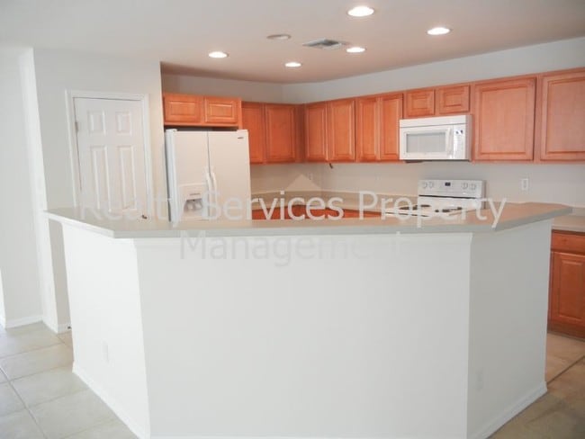 Building Photo - 3 CAR GARAGE...4 BEDROOM , GATED  COMMUNITY