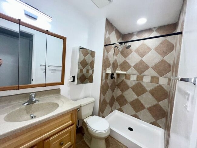 Building Photo - Stunning 4BR Townhome with Hardwood Floors, Private Patio, Community Pool & 2-Car Garage!
