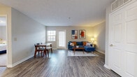 Located at 1720 Deer Creek Dr in Xenia, Ohio, this single-floor, 3-bedroom, 2-bathroom home offers a practical and well-appointed layout. The open-concept living and dining area is bright and welcoming, featuring wood-look laminate flooring, neutral gray walls, and a textured ceiling. A glass-paneled door and flanking windows allow natural light to fill the space, creating an airy atmosphere throughout.

The kitchen connects seamlessly to the main living area and is equipped with warm honey-toned wood cabinetry, white countertops, and a full suite of stainless steel appliances, including an electric range, over-the-range microwave, and dishwasher. A peninsula counter provides additional prep space and a natural division between the kitchen and dining area.

The primary bedroom offers a comfortable retreat with plush carpeting, a large window with outdoor views, and a dedicated closet with built-in shelving. The additional bedrooms share a similarly cozy character with carpeted floors and ample natural light.

The bathrooms are cleanly finished with wood-look vinyl flooring, wood-toned vanity cabinetry, and full soaking tub and shower combinations. Three closets throughout the home provide generous storage. The overall design is functional and move-in ready, making it an ideal home in the Xenia community.