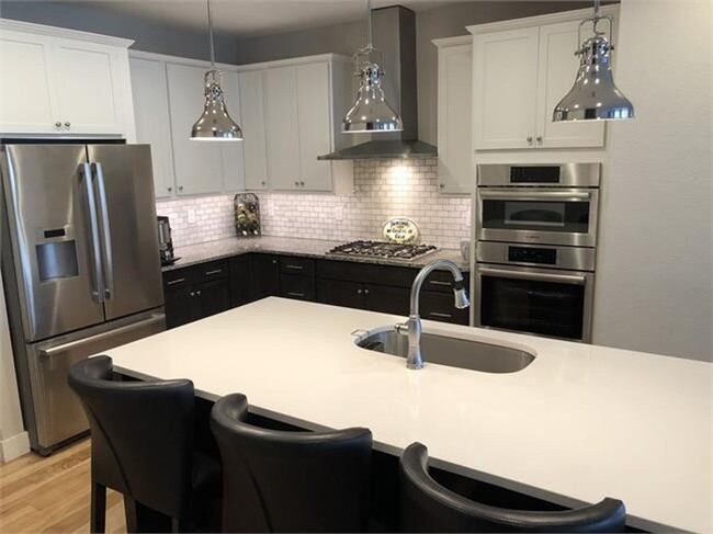 Building Photo - Four Bedroom Townhome with 2-car Garage Av...
