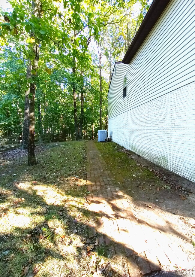 Brick path around left side. - 12539 Cavalier Dr