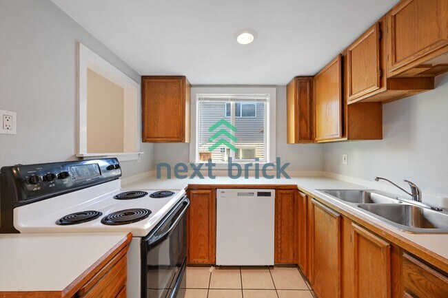Foto del edificio - "Charming 2-Bed Retreat in Seattle's Heart – Cozy 840 Sq Ft Haven on 14th Ave West!"