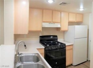 Building Photo - 1830 N Pecos Rd