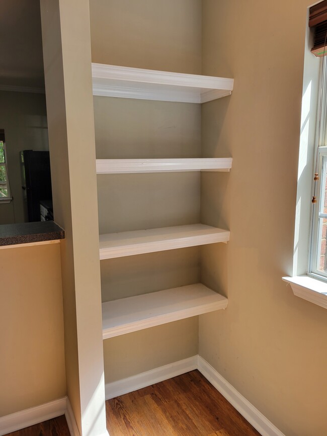 A closer look at the built-in shelving in the living area - 205 Woodstone Dr