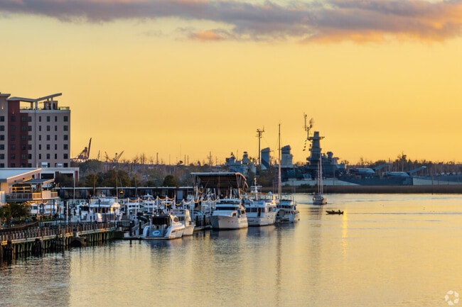 The USS North Carolina battleship rests in view of Wilmington along the Cape Fear River.