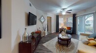 Located at 3021 SR-590 in Clearwater, Florida, this well-appointed single-floor residence offers a thoughtfully designed open-concept layout that seamlessly connects the main living areas. Dark hardwood-style flooring runs throughout the common spaces, creating a cohesive and polished aesthetic.

The kitchen is equipped with stainless steel appliances, including a refrigerator, range, and built-in microwave, complemented by dark cabinetry and granite-style countertops. A breakfast bar with bar stools opens directly to the dining area, which features a bold yellow accent wall, wainscoting detail, and space for a full dining set. An in-unit laundry area is conveniently accessible from the kitchen.

The living room is generously proportioned, anchored by a striking teal accent wall, dark hardwood-style flooring, a ceiling fan, and sliding glass doors that invite natural light. The bedroom features plush carpeting, a ceiling fan, bold accent wall, and sliding glass door access, lending a bright and comfortable atmosphere. The bathroom includes a granite-topped vanity with dark cabinetry, a tub-shower combination, and wood-style flooring.

Overall, the residence balances vibrant color choices with modern finishes, offering a functional and visually engaging living environment in the heart of Clearwater.