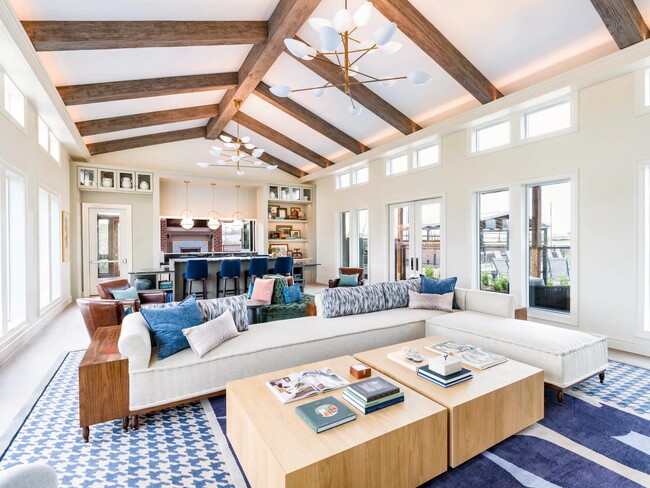 Social gathering and event room with under-counter refrigerator, ice maker, and warming drawer. - Modera McKinney Ridge