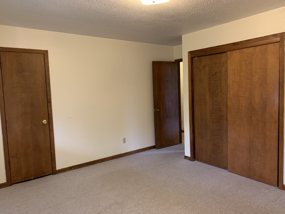 Master bedroom includes 2 closets - 1 is a walk-in with built in shelves. - 1320 5th St W