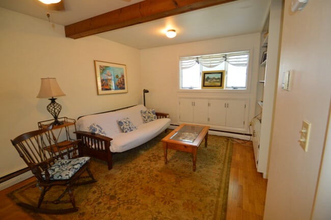Living area with built-in shelves - 28 Merton Rd