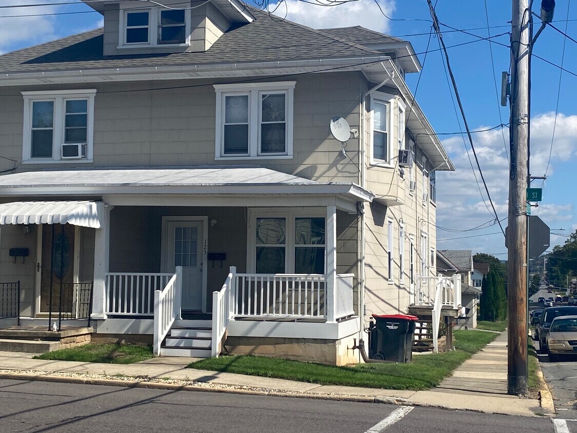 First floor unit. 3 steps up front porch. Entry through front porch and side door into kitchen. - 125 S 9th St