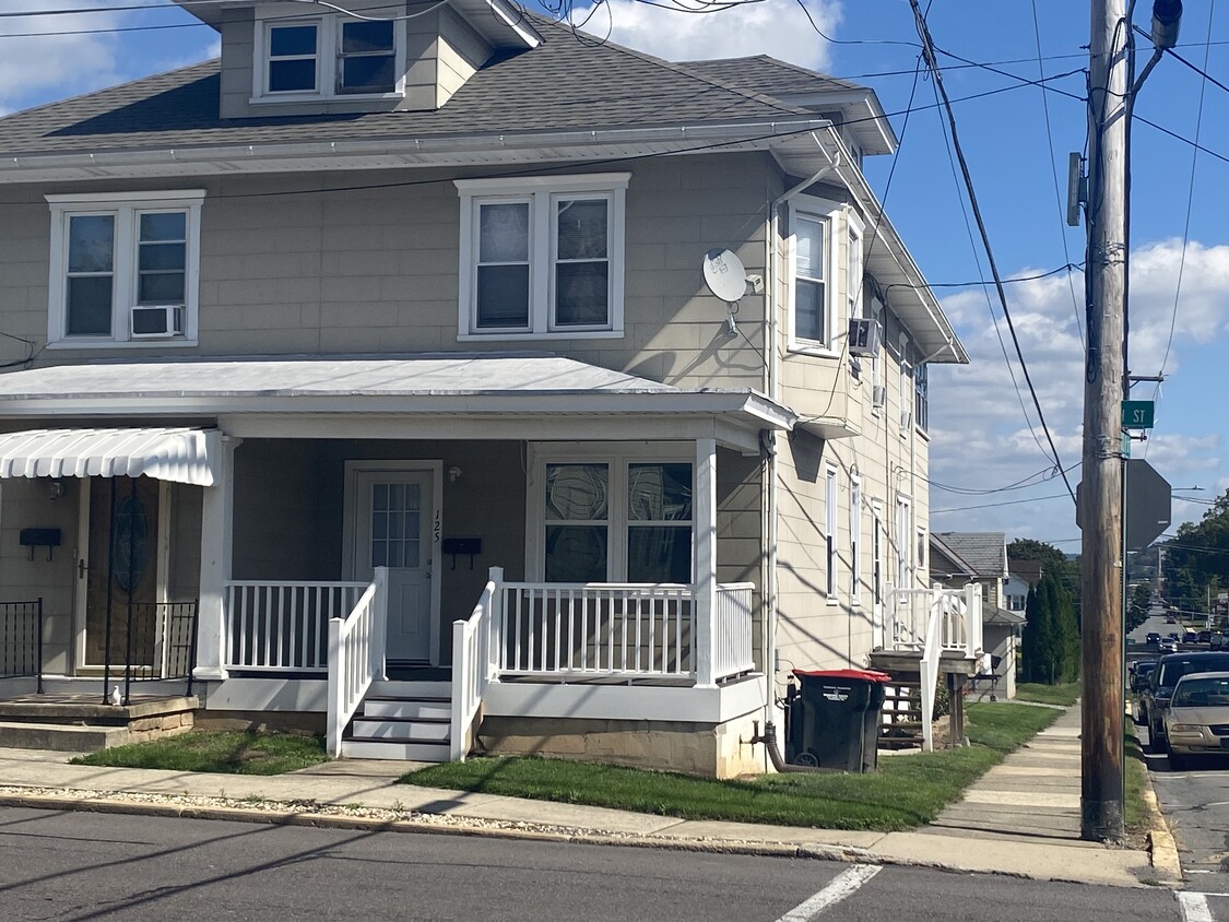 First floor unit. 3 steps up front porch. Entry through front porch and side door into kitchen. - 125 S 9th St