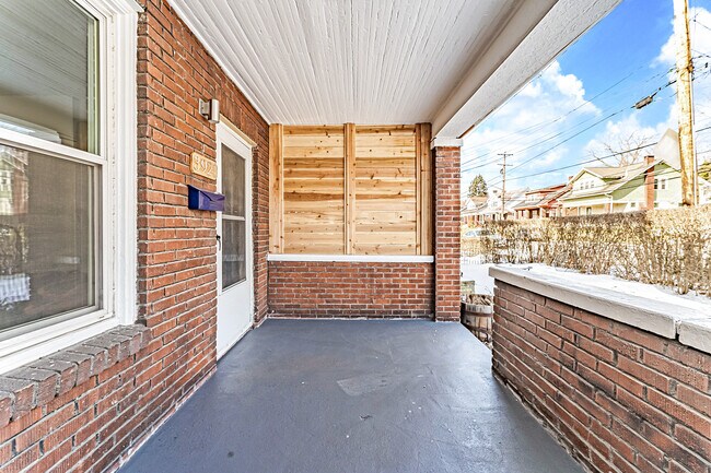 Front porch with privacy wall - 3921 California Ave