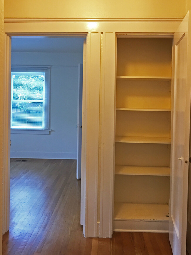 hallway with linen closet, looking toward the bedroom. - 2056 NW Overton St